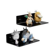 two black shelves with cartoon figurines sitting on top of each shelf, one holding an object