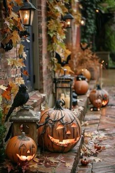 some pumpkins that are sitting on the side of a building with lights in them