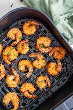 cooked shrimp on a grill with parsley