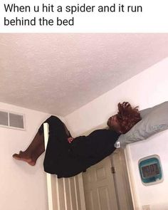 a woman laying on top of a bed next to a man with his feet in the air