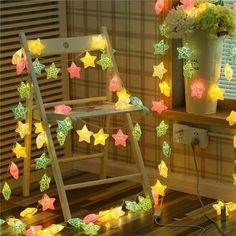 a rocking chair with stars on it and some lights in the room next to it