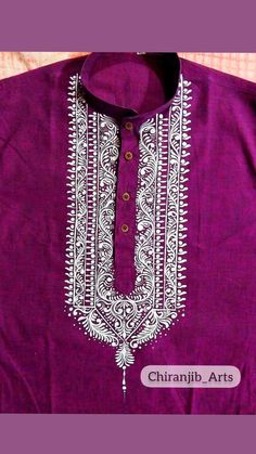 a purple shirt with white embroidery on it