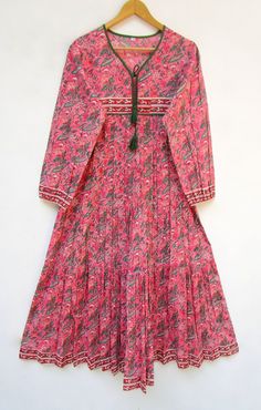 "ITEM DESCRIPTION beautiful pinkish floral printed cotton long maxi dress - v neckline with tassel long maxi dress - long sleeve maxi dress Features: Long sleeve, V neck, Long dress Material: Cotton cambric Fabric: 100% cotton soft light weight ethnic print fabrics Sleeve Length = 22 inch For more sizes & their measurement, please refer our below chart to understand the sizes variations available with us For your size requirement, please mention your size in seller note at the time of buying. SI Pink Anarkali V-neck Dress, Pink Anarkali Dress With V-neck, Pink V-neck Anarkali Dress, Traditional Pink Embroidered Maxi Dress, Pink Cotton Maxi Dress With Long Sleeves, Pink V-neck Maxi Dress With Tassels, Pink Block Print Long Sleeve Dress, Pink Anarkali Dress With Floral Print, Pink Anarkali Maxi Dress