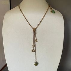 This wonderful necklace has all the bells and whistles: a chatelaine clip, a double chain with a wax seal hanging from it, an engraved initial (M) on the seal, a terrier dog charm, a jade heart charm and 2 short chains up a ways on the chain which have another carved jade charm and a vintage pendant with a jade cabochon. (This pendant is gold filled.) The necklace part is an antique watch chain (Victorian) joined to another antique watch chain by bulldog clip. Quite a lot in this interesting nec Bulldog Clip, Initial M, Jade Charm, Antique Watches, Double Chain, Dog Charms, Chatelaine, Watch Chain, Jade Carving