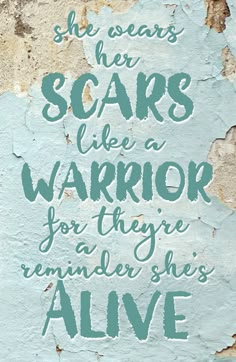 a quote on the wall that says she wears scars like a warrior for there remains she's alive