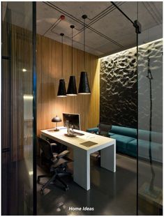 an office with a desk, chair and lamp