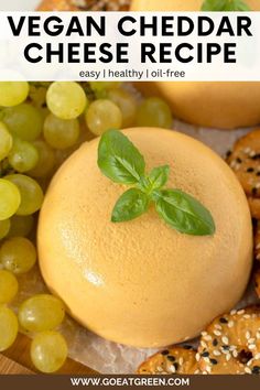 vegan cheddar cheese recipe on a plate with grapes and pretzels