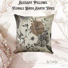 a pillow with flowers on it and the words elegant pillows - floral birds, earth tones