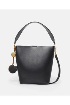 Harnessing industrial symbiosis to repurpose apple waste from the food industry, this Frayme bucket bag from Stella McCartney is innovated from smooth UPPEAL. With whipstitched sides, a detachable top handle and a rounded square shape, its perfect for city-to-country wear  keep your daily essentials, phone and wallet at arms reach, no matter the scenery.     Color: Brown  Tan brown  Comfortably fits all phones and wallets alongside daily essentials  UPPEAL vegan alternative to animal leather sou Stella Mccartney Frayme, Bucket Tote Bag, Stella Mccartney Shoes, Bucket Tote, Vegan Alternatives, Country Wear, Rounded Square, Tote Bag Black, Food Industry