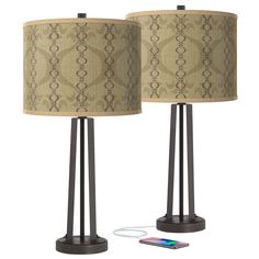 two lamps are next to each other on a white background