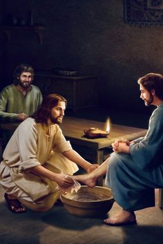 jesus sitting on the floor with his feet in a bowl and two men standing behind him