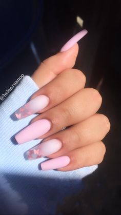 a woman's hand with pink and white nails