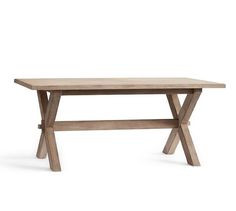 a wooden table sitting on top of a white floor