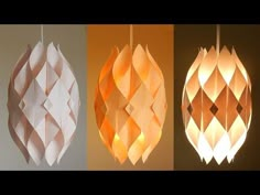 three different types of paper lamps hanging from the ceiling, one with an origami design on it