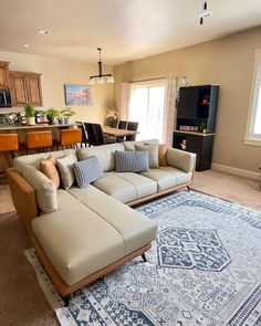 a living room filled with furniture and a rug