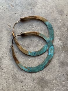 "Solid 8 gauge brass has been hand-hammered into large hoops. I then added several layers of grungy turquoise patina and oxidized the entire hoop for a rustic look. Hypoallergenic niobium earwires 2.5\" wide and 2.75\" long Handmade in NY" Hand Forged Bronze Small Hoop Jewelry, Bronze Hoop Pierced Earrings, Hand Forged Bronze Hoop Earrings, Hand-forged Bronze Hoop Earrings, Bronze Hand Forged Hoop Earrings, Unique Metal Hoop Earrings, Brass Hoop Wrap Earrings, Vintage Small Hoop Brass Earrings, Vintage Brass Small Hoop Earrings