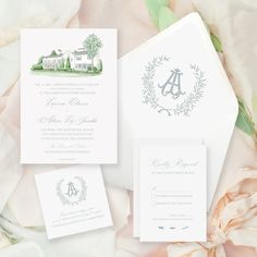 the wedding stationery is laid out on a bed of flowers