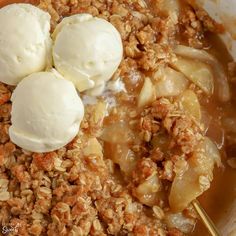 two scoops of ice cream are on top of the apple crumbled oatmeal