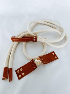 Discover the perfect addition to your summer wardrobe - Rope Belt. This elegant rope combined with leather blends style and practicality in the best possible way. Made from high-quality cotton and durable leather, it is the ideal choice for a chic look. Whether you're taking a relaxed stroll through the city or embarking on an adventurous journey, the rope belt will be a reliable companion. Its exceptional combination of materials ensures comfort, durability, and resilience, while its elegant de Rope Belt, Suspender Belt, Cotton Rope, Slovenia, Look Chic, Suspenders, Summer Wardrobe, Cognac, Elegant Design