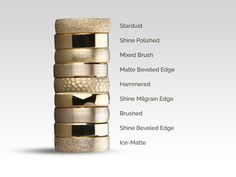 a stack of different types of wedding rings on top of each other with names in the middle