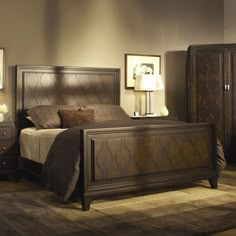 a bed room with a neatly made bed and dressers