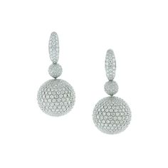 A magical pair of earrings featuring 12.80 carats of VS quality round cut diamonds set into 18K white gold spheres. The spheres, which are completely covered in diamond pave, spin and rotate freely from the drop adding movement to the piece. A special pair of earrings, quality craft. Dimensions: 1.40 x 0.50 inches White Gold Drop Earrings, Trillion Diamonds, White Gold Diamond Earrings, Pave Jewelry, Diamond Earrings Design, Earrings Design, Long Drop Earrings, Gold Diamond Earrings, Earring Crafts