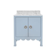 a blue vanity with a white marble top and two brass handles on the front door