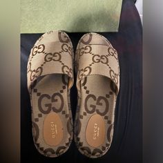 Marco Gg Canvas Gucci Platform Sandals. Worn Once. Price Firm. Designer Slides With Branded Insole For Beach, Designer Beach Slides With Branded Insole, Designer Flat Slides For Beach, Designer Brown Sandals For Vacation, Gucci Brown Slip-on Sandals, Designer Open Toe Slides For Vacation, Luxury Slip-on Slides For Vacation, Designer Open Toe Slides For Beach, Luxury Flat Heel Slides For Beach