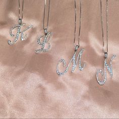 Silver Rhinestone Initial Necklaces With A Lobster Clasp. Cz (Cubic Zirconia) Pave Pendent Necklace. Also Available In Gold For Certain Letters Only. Approx Length: 22 Made In Korea Initial Jewelry Silver, Heart Stone Necklace, Purple Stone Necklace, K Necklace, Rose Gold Chain Necklace, Ruby And Diamond Necklace, Silhouette Necklace, Initial Necklace Silver, Gold Collar Necklace