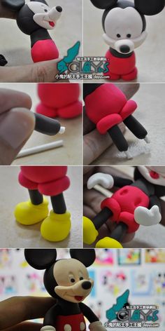 the mickey mouse toy is being made by someone's hand and it looks like they are