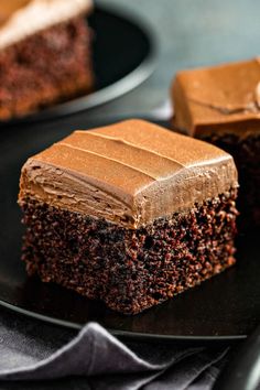 chocolate mayonnaise cake on a black plate with the title in the middle above it