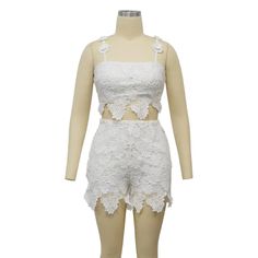 Indulge in luxury with our Feminine Lace Applique' Shorts Set. Featuring delicate lace appliques, this set exudes elegance and sophistication. Perfect for a romantic evening or a special occasion, this set will make you feel confident and stylish. Elevate your wardrobe with this exclusive piece. Sizes S-2XL Decoration Zip Up , Lace Length Above Knee, Mini Style Sexy & Club Fabric Type Blended fabrics , Lace Material Polyester , Spandex Neckline Strappy Pattern Type Solid Sleeve Length Sleeveless Fitted Sleeveless Lace Set, White Lace Party Set, Feminine Fitted Sets With Lace Trim, White Lace Feminine Sets, White Lace Sets For Summer, Elegant Lace Sets For Night Out, Summer Party Lace Sets, Spring Wedding Lace Sets, Fitted Lace Summer Sets