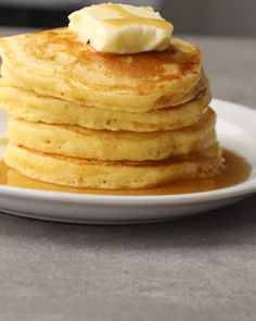 a stack of pancakes with butter on top