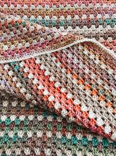 a crocheted blanket laying on top of each other