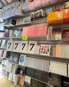 the shelves are filled with books and cds for sale in a store or book store