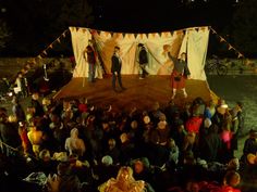 a group of people standing on top of a stage