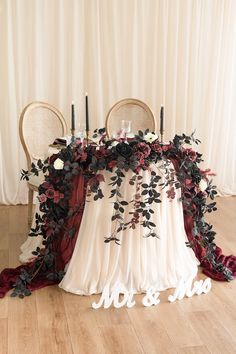 the table is decorated with flowers and candles