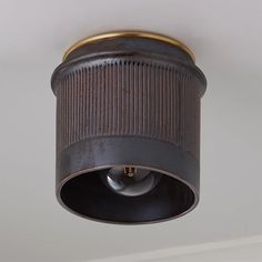 an old fashioned ceiling light hanging from the ceiling