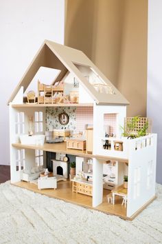 A true heirloom piece that will be enjoyed for generations! Our Oak Street Dollhouse is USA made in Albany, Minnesota with meticulous craftsmanship and designed by us with every detail in mind. This high-quality dollhouse is truly a stunner, and you'll love the butter smooth finish of the spray lacquer. All pieces are carefully inspected and sanded by hand. The floors are made of Baltic Birch plywood and clear coated to prevent scratches and mark Modern Dollhouse Furniture, Miniature Dollhouse Accessories, Horse Stable, Doll House Plans, Dollhouse Toys, Modern Dollhouse, Saint Joseph, Toy Horse, Meaningful Connections