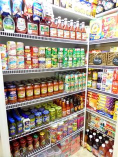 the shelves are filled with many different types of condiments