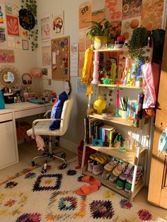 a room filled with lots of clutter and furniture next to a wall covered in pictures