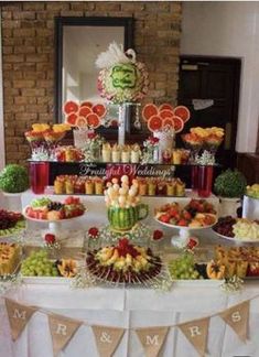 a table filled with lots of different types of food on top of a phone screen