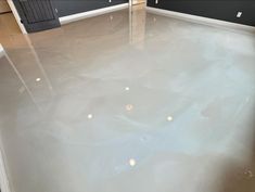 an empty room with water on the floor