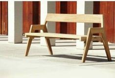 two wooden benches sitting next to each other