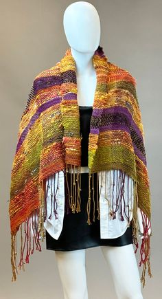 This uniquely designed, one of a kind Southwest flavor art shawl can be used for any occasion! Dress up or throw on a pair of boots and jeans. This shawl has 6mm decorative gold metal beads hand tied into the fringe so you get the added benefit of the drape when wearing this beautiful wrap.  This shawl measures 50"x29"+7" fringe per side. Handmade Shawl For Festivals, Artisan Shawl One Size For Fall, Bohemian Handmade Shawl For Festivals, Gold Shawl For Fall, Bohemian Shawl For Fall Festive Occasion, Bohemian Shawl For Festive Fall Season, Woven Multicolor Shawl For Fall, Traditional Woven Shawl For Fall, Traditional Fall Festival Scarves