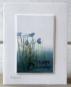 a card with blue flowers on it and the words happy birthday written in black ink