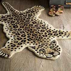 a leopard print rug on the floor next to shoes