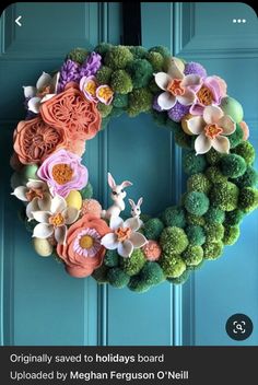 an image of a wreath made out of flowers on the front door with text that reads, originally saved to holidays board uploaded by megan ferguson o'n'neil