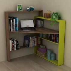 a laptop computer sitting on top of a wooden shelf next to a bookcase filled with books