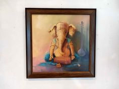 an elephant painting hanging on the wall